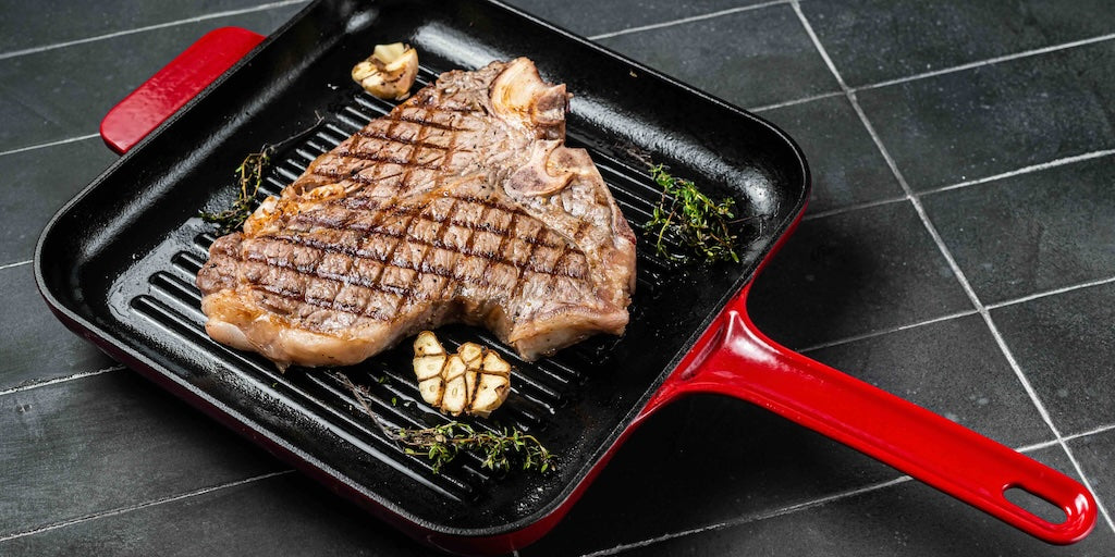 cooking a steak in a cast iron skillet